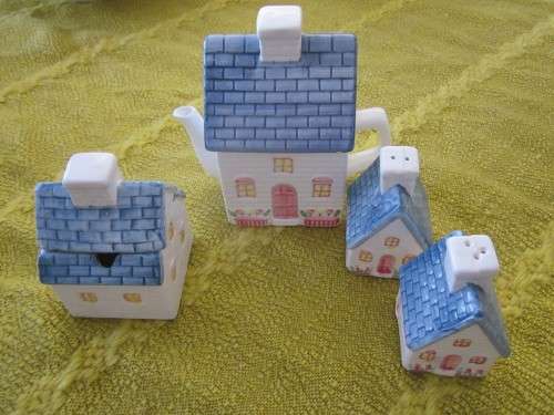 Ornametal tea set-(tea, sugar, salt, pepper house like pots)