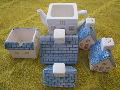 Ornametal tea set-(tea, sugar, salt, pepper house like pots)