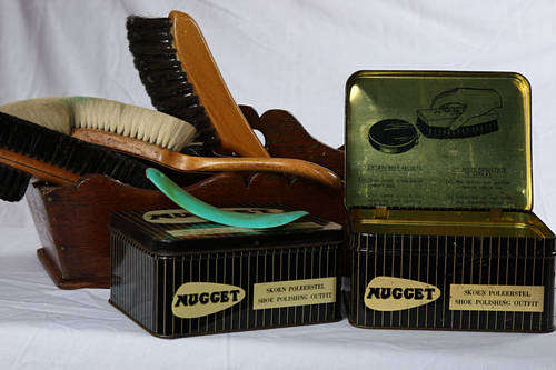 Old empty Nugget shoe polish tins large and 3 very old brushes and wooden carrier