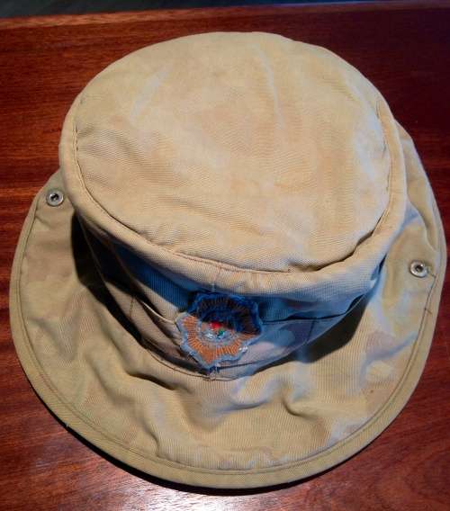 Old faded sap camo bush hat with dayglo inner size 62