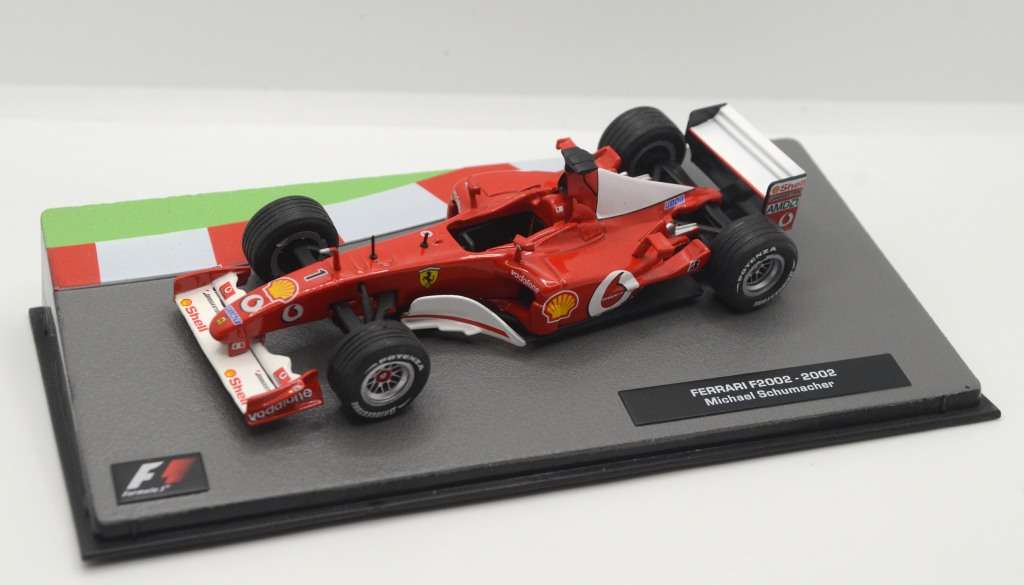 Ferrari F2002 as driven by Michael Schumacher in 2002 with magazine