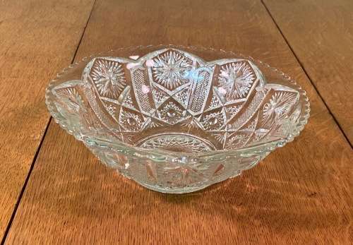GLASS BOWL SMALL with pressed STAR SHAPED PATTERNS.