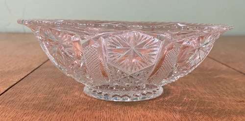 GLASS BOWL SMALL with pressed STAR SHAPED PATTERNS.