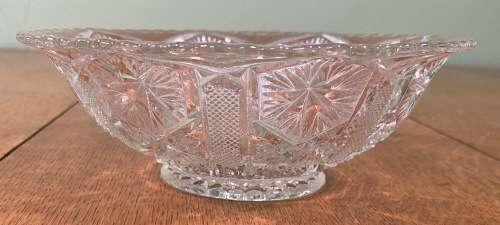 GLASS BOWL SMALL with pressed STAR SHAPED PATTERNS.