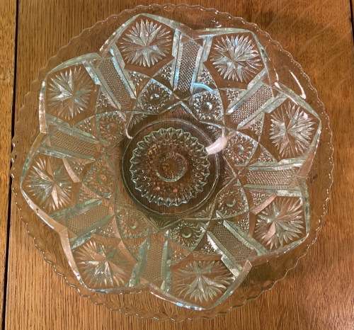 GLASS BOWL SMALL with pressed STAR SHAPED PATTERNS.