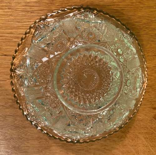 GLASS BOWL SMALL with pressed STAR SHAPED PATTERNS.