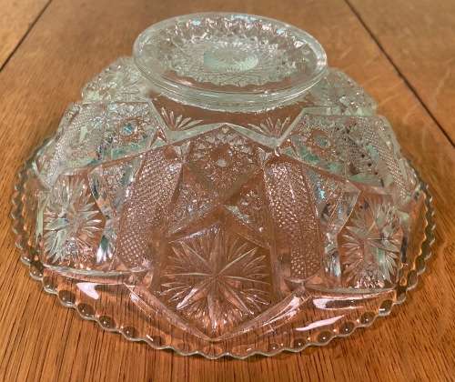 GLASS BOWL SMALL with pressed STAR SHAPED PATTERNS.