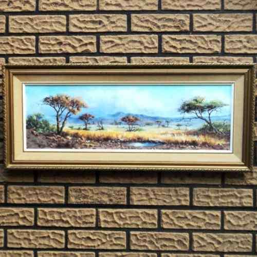 Dirk Venter (S A Artist). BUSHVELD LANDSCAPE WITH WATER PAN. Oil. Framed. 400 x 900 mm. 1976.