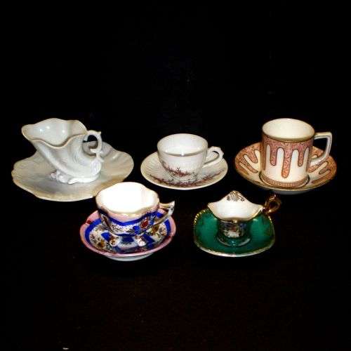 Five miniature porcelain cups and saucers. Sold together.