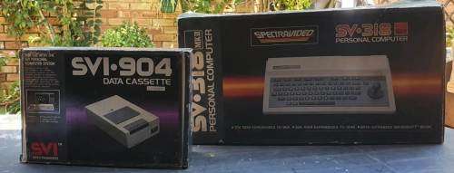 Spectravideo SV 318 and cassette recorder in original packaging.