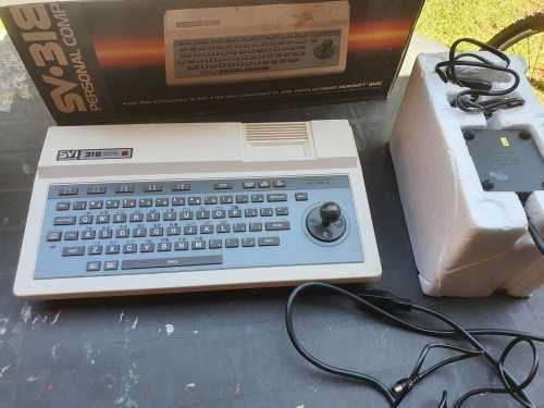 Spectravideo SV 318 and cassette recorder in original packaging.