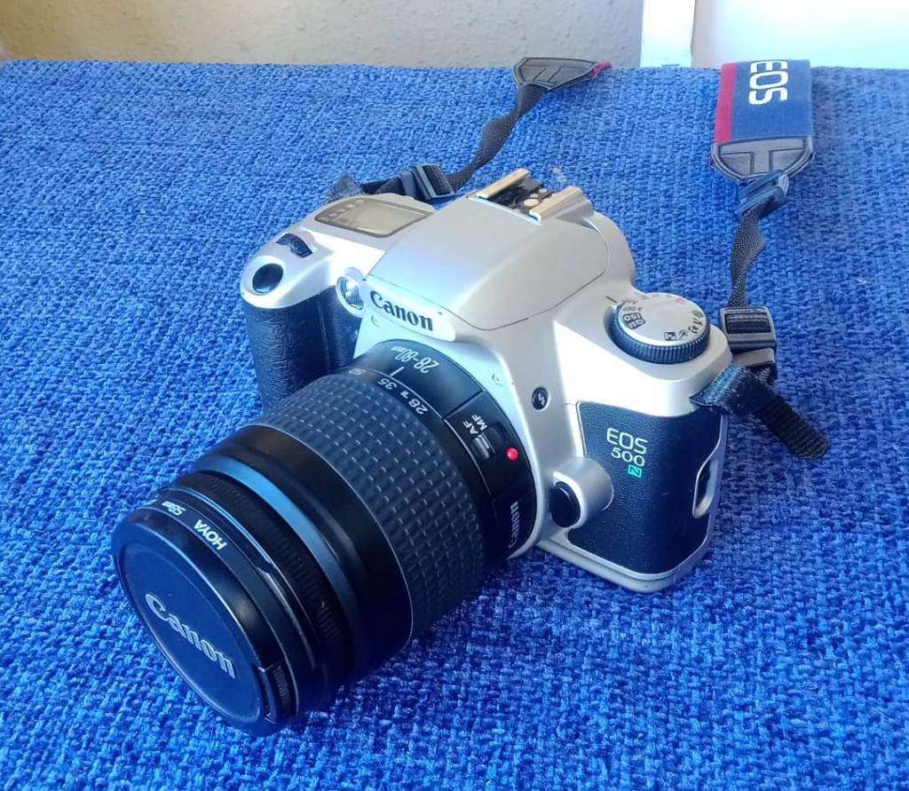 Canon EOS 500N 35mm film camera with 28 to 80mm zoom lens.