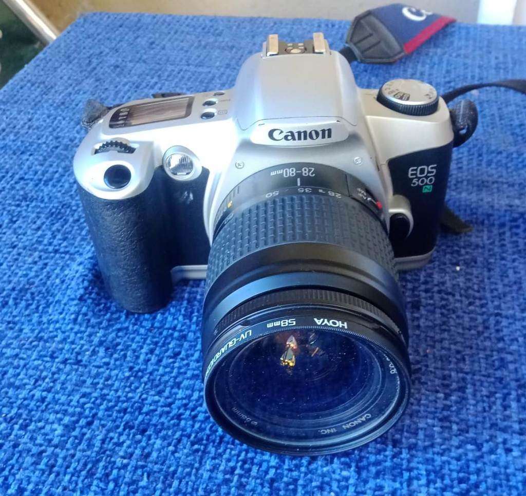 Canon EOS 500N 35mm film camera with 28 to 80mm zoom lens.
