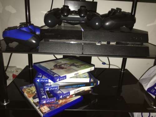 PlayStation 4 with 3 controllers and 6 Games