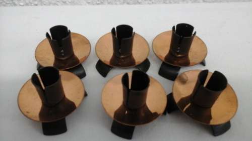 6 MAGNIFICENT COPPER CANDLE HOLDERS. ON THREE METAL FEET. TOTALLY UNUSUAL