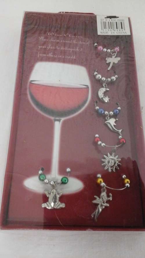 ABSOLUTELY EXQUISITE SET OF SIX WINE CHARMS. MADE IN CHINA. FANTASTIC AND AWESOME PIECE!