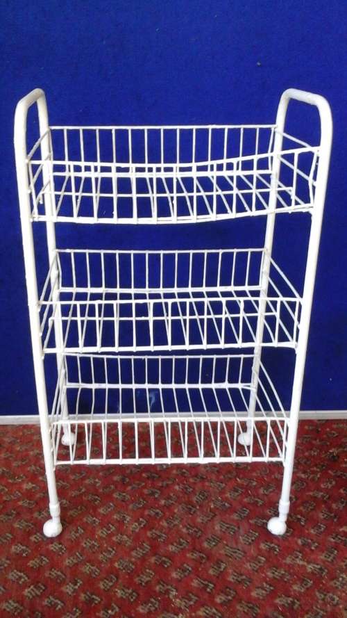 ITS VINTAGE BUT ITS USEABLE. A FANTASTIC WHITE WIRE VEGEATABLE BASKET ON WHEELS