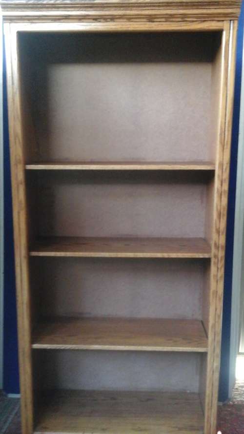 A PHENOMENAL STRONG AND STURDY OAK TYPE BOOK SHELF. LAYERED OUTLINE AND MASONITE BACK