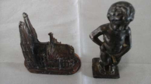 HIGHLY COLLECTIBLE A STATUE OF THE NAUGHTY LITTLE BOY AND A MODEL OF DOM ZU KOLN
