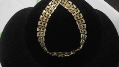 UNUSUAL SHAPED LINKS AND DESIGN. LOOKS LIKE GOLD. NOT MARKED SO POBABLY IS NOT. AN EXTREMELY CLASSY