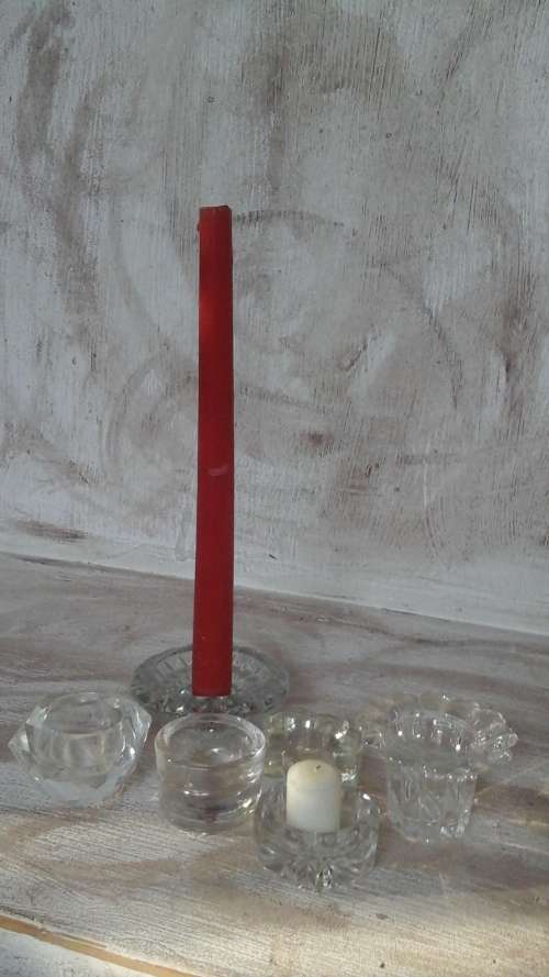 A HIGHLY COLLECTIBLE COLLECTION OF GLASS CANDLE HOLDERS ALL DIFFERENT SHAPES