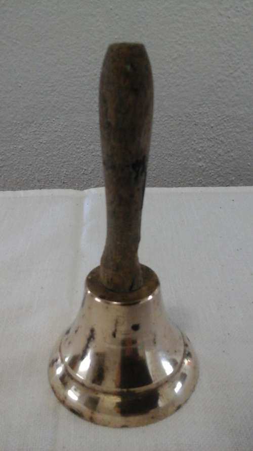 HISTORICAL AND WELL WORN. THIS VINTAGE COPPER BELL WITH A WOODEN HANDLE HAS DRAWN LOTS OF ATTENTION