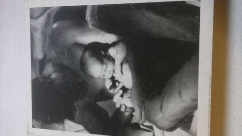 SIMPLY INCREDIBLE VINTAGE BABY AND MAN PHOTOGRAPH POSTER ON BOARD. SPENCER ROWELL ENGLAND 1986!