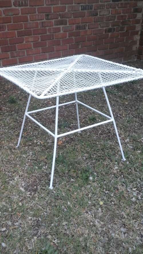STRAIGHT FROM THE SEVENTIES. A SPECTACULAR WIRE AND ROUND BAR GARDEN TABLE SEATS FOUR.