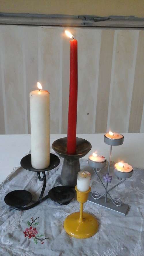 HIGHLY COLLECTIBLE COLLECTION OF FOUR CANDLE HOLDERS. ALL STEEL AND DIFFERENT STYLES