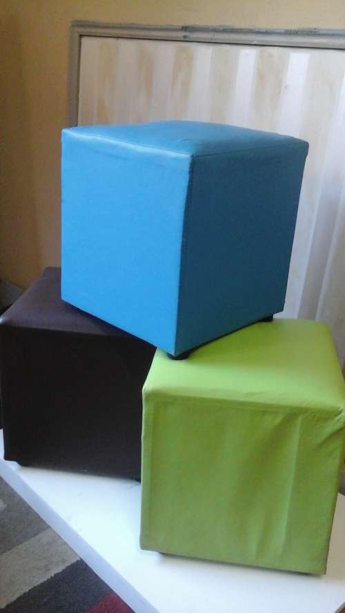 THREE TERRIFIC LEATHERETTE OTTOMANS. FANTASTIC AND VERY USEFUL!