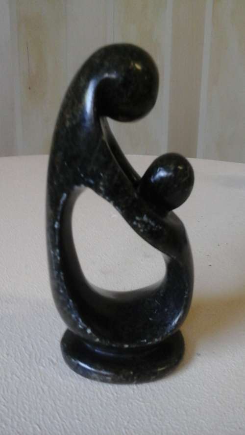 BEAUTIFUL ORNATE  STONE CARVING ORNAMENT OF TWO PEOPLE EMBRACING.