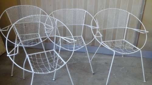 FOUR FANTASTIC VINTAGE ROUND BAR AND WIRE GARDEN CHAIRS. THEY GO BACK TO THE SEVENTIES. TERIFFIC!