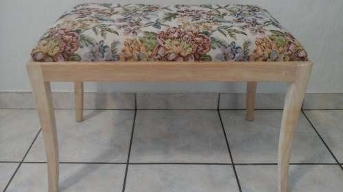 CALL IT A DRESSING TABLE STOOL OR A PIANO STOOL.FABRIC ON THE SEAT COMPLIMENTS THE SMOOTH WOOD