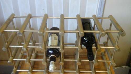 SIMPLY TERRIFIC WOODEN WINE RACK. FITS 18 BOTTLES. AWESOME & FUNCTIONAL PIECE!