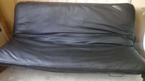 FABULOUS COMFORTABLE SLEEPER COUCH. MADE FROM GOOD QUALITY PLEATHER WITH A STEEL FRAME