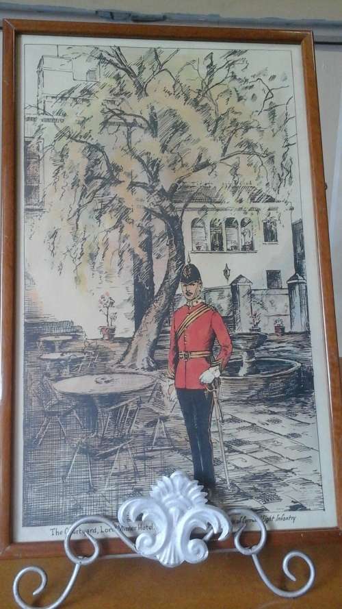 A MAGNIFICENT PRINT THE COURTYARD, LORD MILNER HOTEL MATJIESFONTEIN