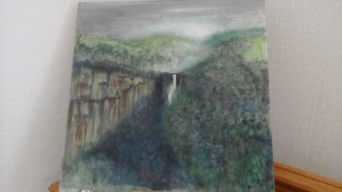 UNFRAMED AND UNSIGNED A MAJESTIC POSSIBLY ACRYLLIC PAIN TING OF A WATERFALL IN THE MOUNTAINS