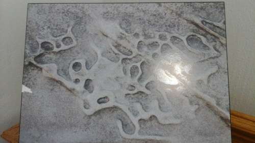 AN UNUSUAL BLOCKMOUNTED ABSTRACT TYPE OF PRINT OF POSSIBLY PEBBLES. NICE PIECE