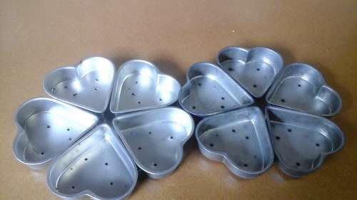 TWO MAGNIFICENT MULTIPLE HEART SHAPED VINTAGE TART OR BISCUIT PANS.