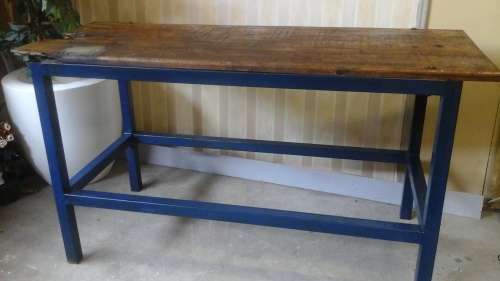 A MAGNIFICENT VINTAGE STEEL WORK BENCH WITH A SOLID WOOD SLATTED TOP.