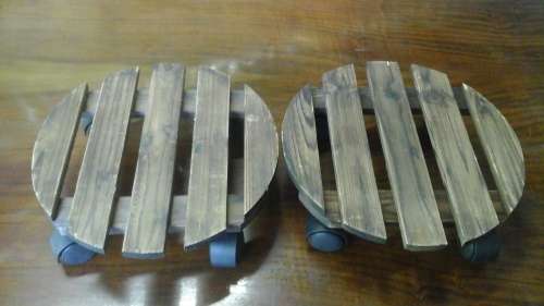 TWO TERRIFIC AND DIFFERENT WOODEN POT STANDS ON WHEELS. FANTASTIC AND PRACTICAL!