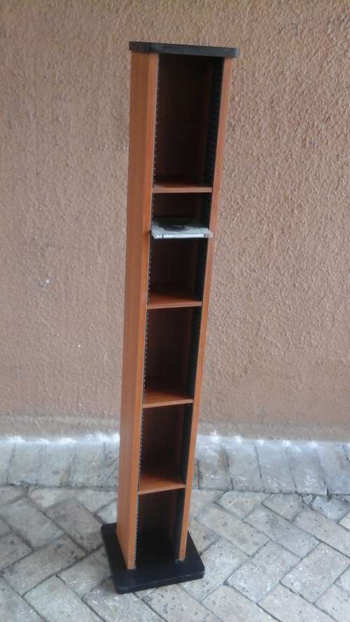 A PRACTICAL TALL WOODEN CD RACK. CAN PROBABLY TAKE 100 CDS. USEFUL PIECE