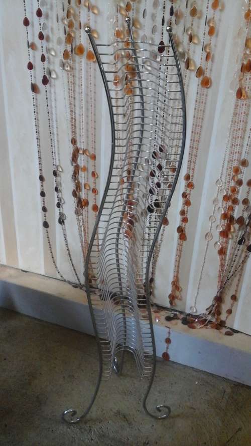 FANTASTIC CHROME CD RACK. AWESOME AND USEFUL PIECE!