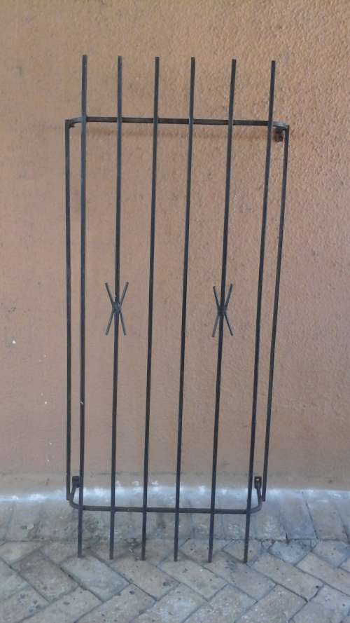 KEEP YOUR HOME SECURE. FANTASTIC SPANISH STYLE BURGLAR BAR. GIVE YOU SLIGHT MORE PEACE OF MIND!