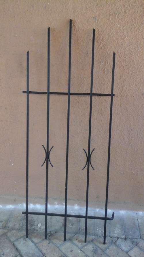 KEEP YOUR HOME SECURE. FANTASTIC SPANISH STYLE BURGLAR BAR. GIVE YOU SLIGHT MORE PEACE OF MIND!