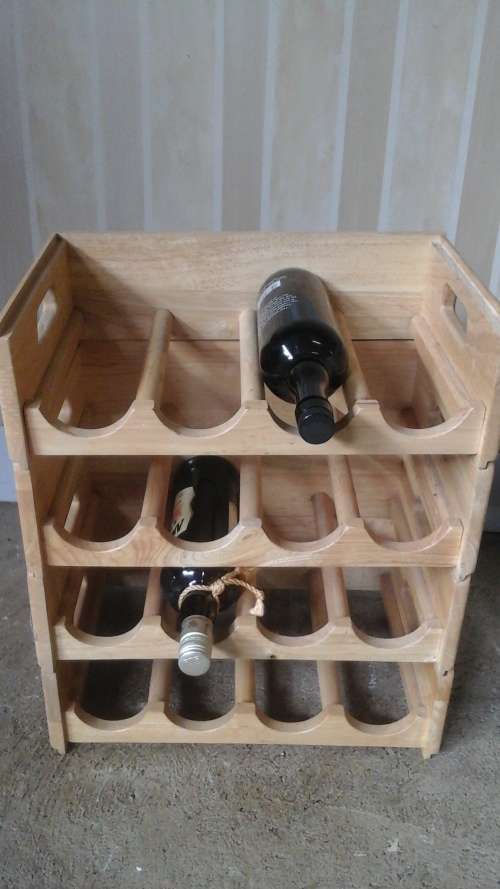 ABSOLUTELY FANTASTIC SET OF FOUR STACKABLE WOODEN WINE RACKS. TERRIFIC STORAGE PIECE!