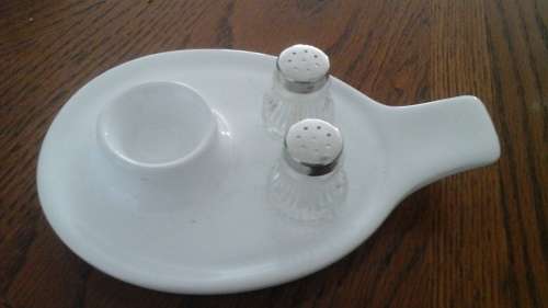 WOW!!! AND EGG CUP WITH A BUILT IN SAUCER. HAS SPACE FOR A SALT AND PEPPER CELLAR.THESE ARE INCLUDED