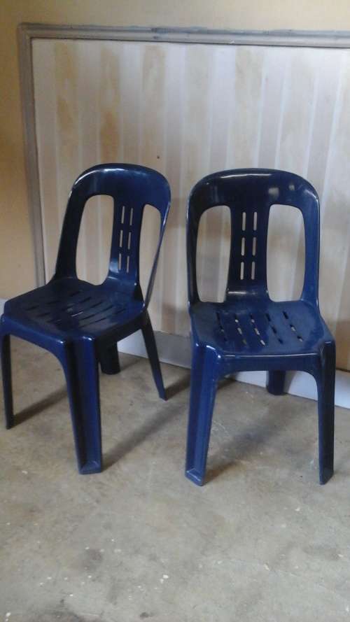 TWO FANTASTIC OUTDOOR PLASTIC CHAIRS. THEY ARE STACKABLE. USEFUL AND TERRIFIC SET!