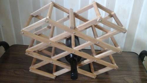 GORGEOUS FOLDABLE WOODEN WINE RACK. HOLDS 8 BOTTLES. REALLY FANTASTIC & FUNCTIONAL PIECE!