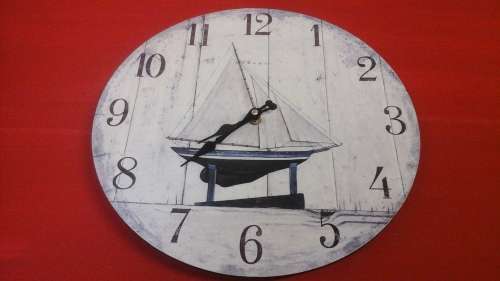 GORGEOUS ROUND WOODEN WALL CLOCK. HAS A PICTURE OF A YACHT. TERRIFIC PIECE!